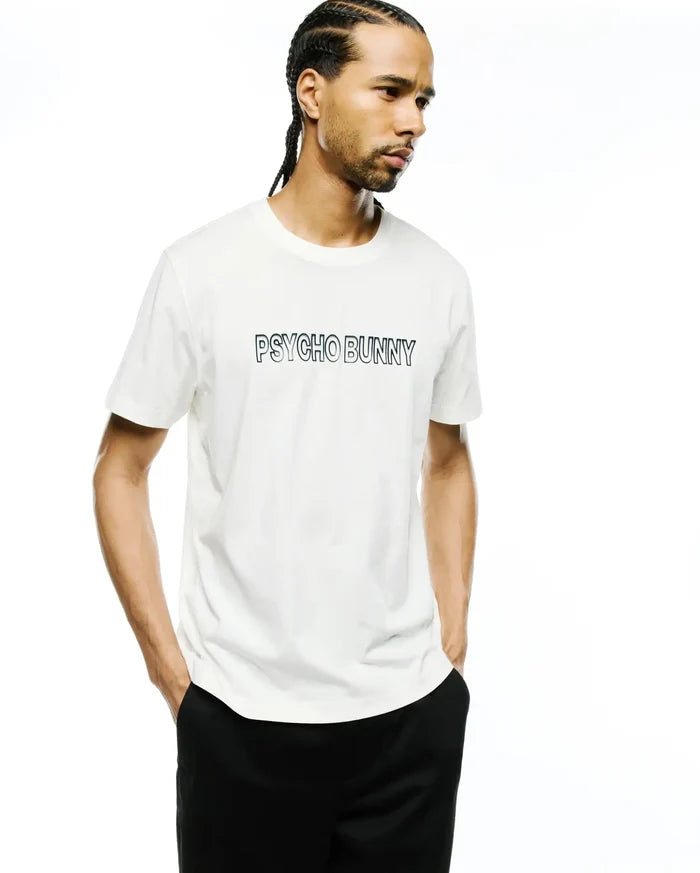 Premium white classic fit short-sleeve jersey t-shirt with a prominent black outline PSYCHO BUNNY wordmark graphic centered on the chest. Mens Joji Wordmark Graphic Tee.