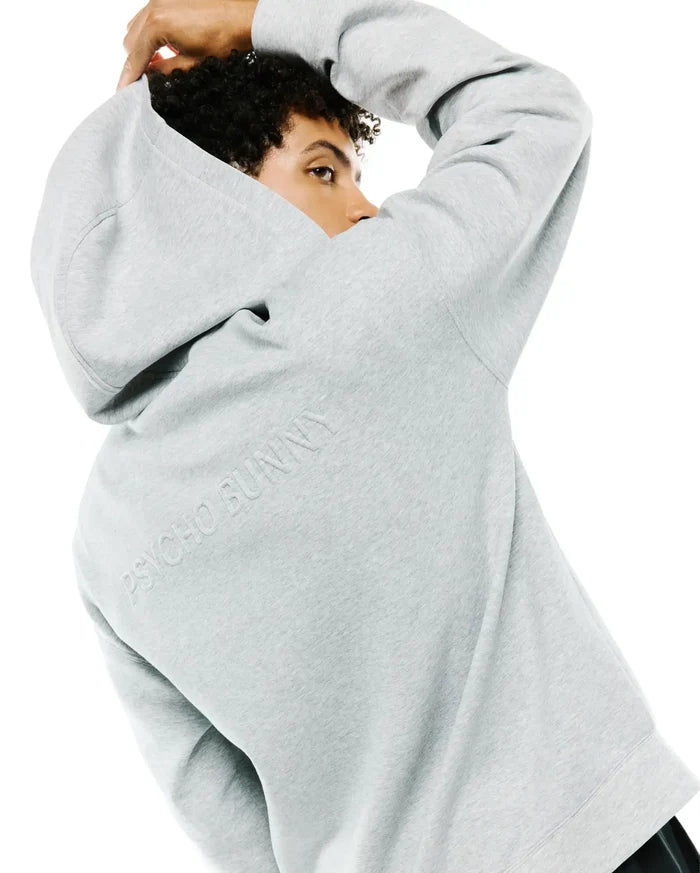 Mens Jonathan Zip Hoodie in heather grey, featuring a relaxed fit and soft french terry fabric. Large embossed PSYCHO BUNNY text is prominently displayed on the upper back.