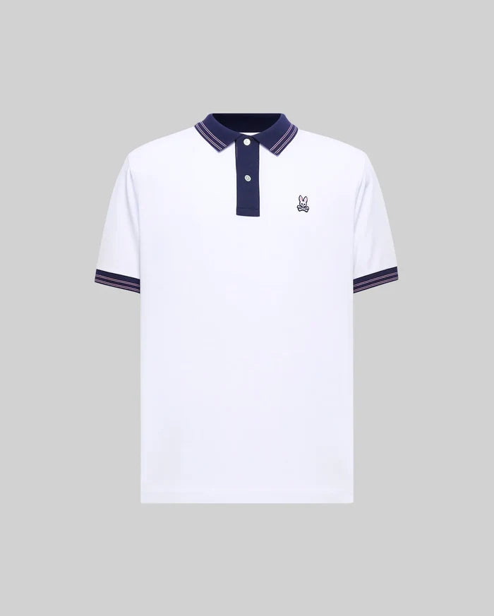 Mens Kenyon Lightweight Pique Polo, white with navy blue collar and placket, featuring pink striped tipping on collar and sleeve cuffs, and a small embroidered Psycho Bunny skull logo on the left chest.