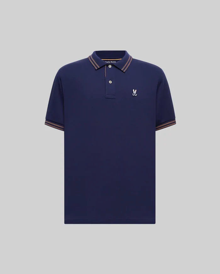 Mens Kenyon Lightweight Pique Polo in navy, featuring a classic fit, pique fabric, orange-brown and white striped collar and cuffs, and a small white embroidered Psycho Bunny skull logo on the left chest.