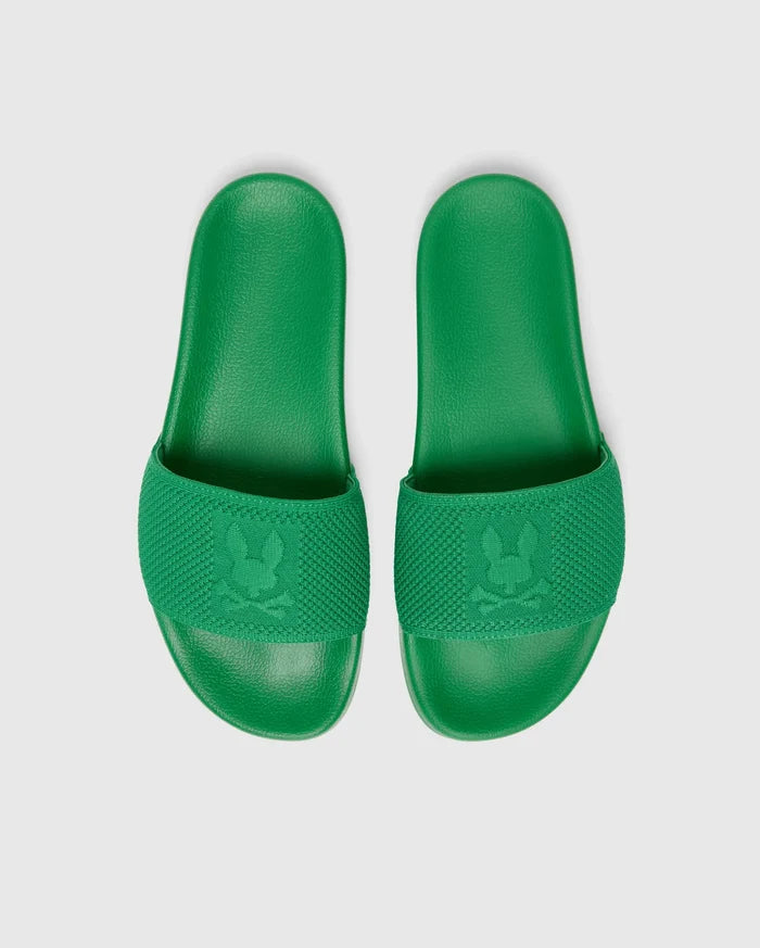 Vibrant green Mens Knit Slides featuring a textured knit strap with a prominent embossed Psycho Bunny skull logo and a comfortable, textured footbed.
