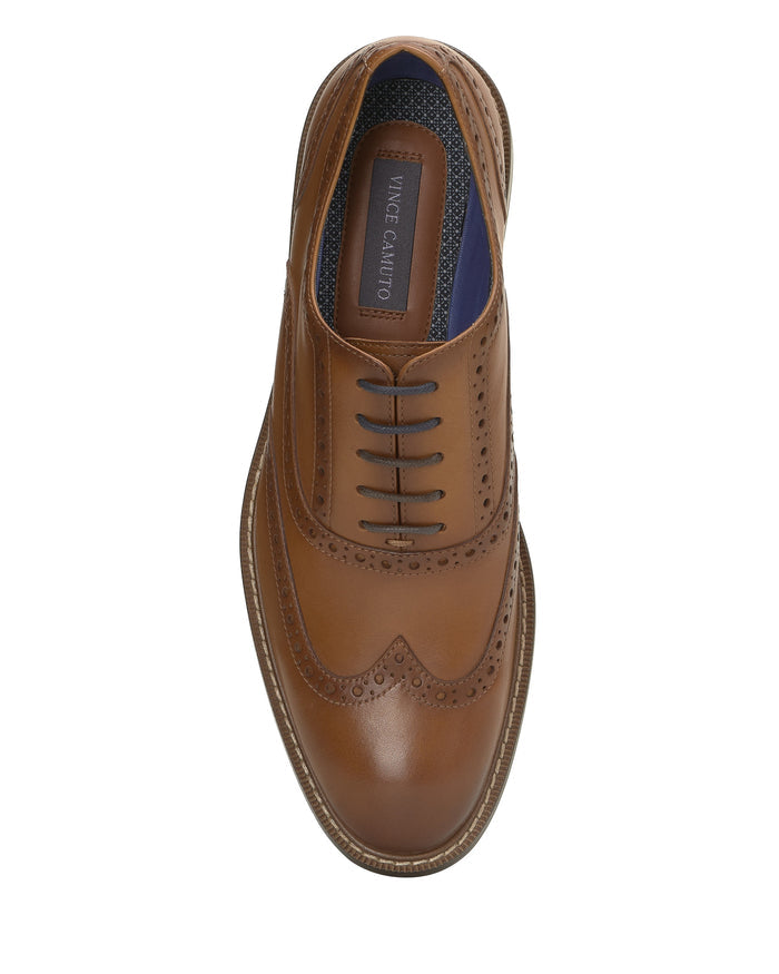 A top view of the Vince Camuto Men’s Lazzarp Wingtip Brogue showcases luxe leather with classic brogue detailing, dark laces, a stitched sole, and a branded insole—perfect for elevating any office outfit.