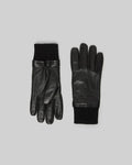 Black Mens Leather Gloves with smooth texture, featuring black ribbed knit cuffs and an embossed Psycho Bunny skull logo on the back of the hand.