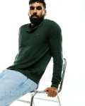 MENS LEROY LONG SLEEVE KNIT POLO in deep forest green, featuring a textured knit fabric, classic collar, ribbed cuffs, and a small embroidered Psycho Bunny skull logo on the left chest.
