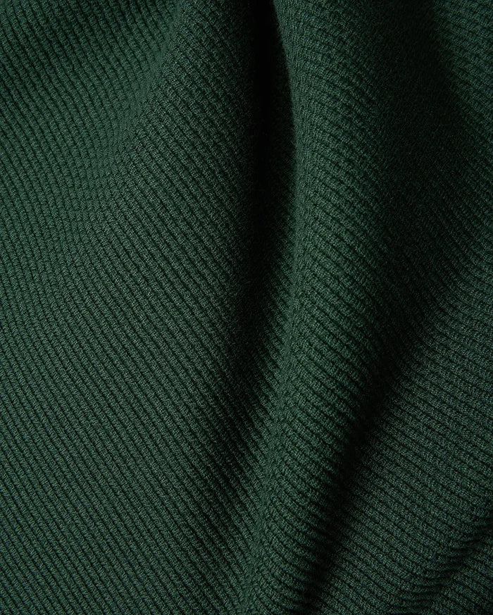 Mens Leroy Long Sleeve Knit Polo in dark green, featuring a prominent ribbed knit texture with subtle fabric folds.