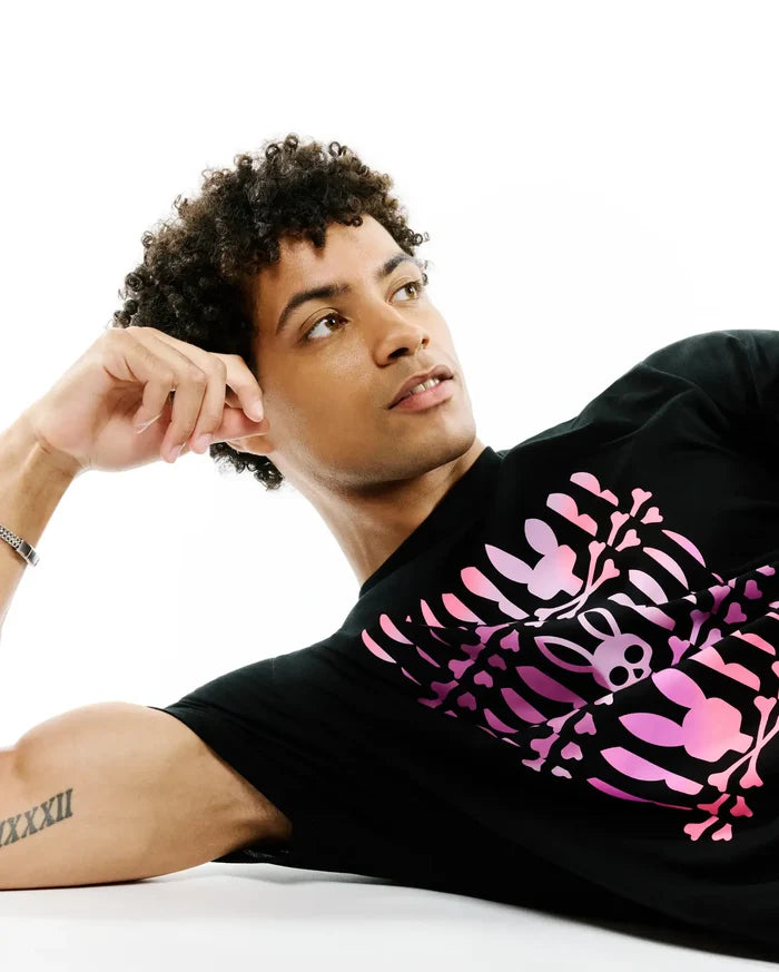 Mens Lewis Graphic Tee, black classic fit jersey t-shirt featuring a large pink gradient graphic print of a skeleton rib cage formed by iconic bunny skulls and bones on the front.
