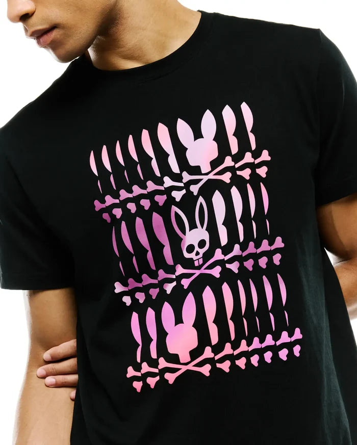 Mens Lewis Graphic Tee, a black classic fit jersey t-shirt featuring a large central pink gradient Psycho Bunny skull and crossbones graphic print in a repeated pattern.