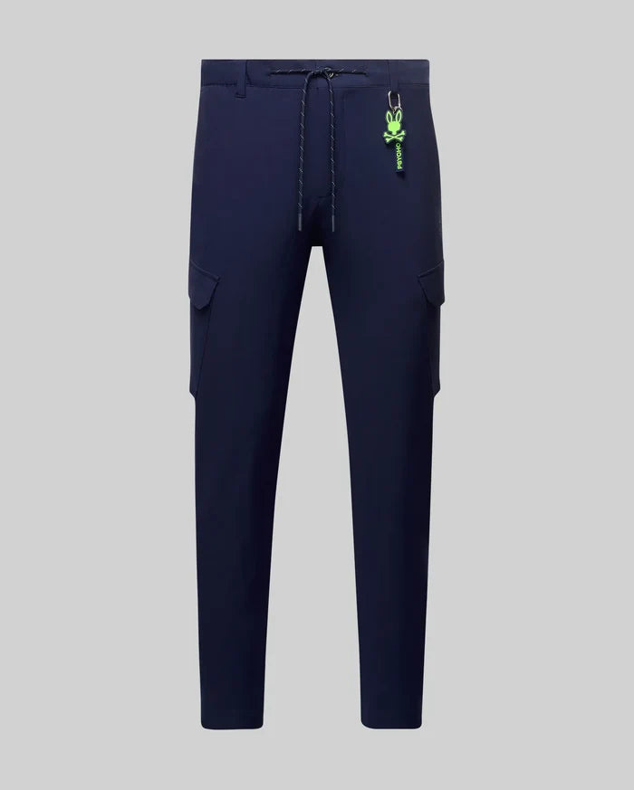 Mens Luka Cargo Pant in navy, featuring a relaxed fit, cargo pockets, drawstring waist, and a detachable neon green Psycho Bunny skull keychain.