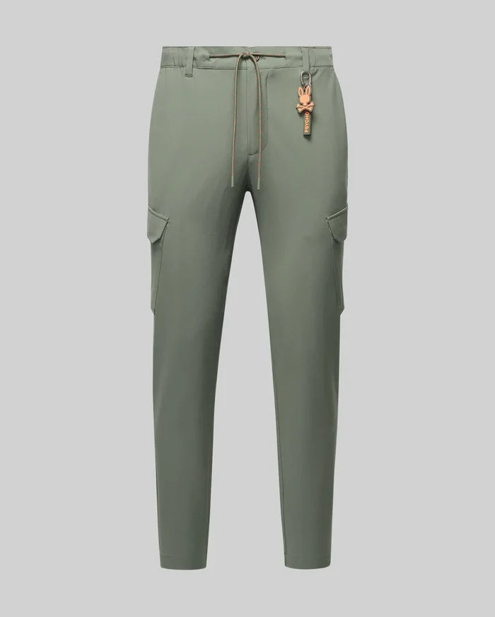 Mens Luka Cargo Pant in sage green, featuring a relaxed fit, smooth fabric, side cargo pockets, an orange drawstring, and a distinctive orange Psycho Bunny skull keychain.