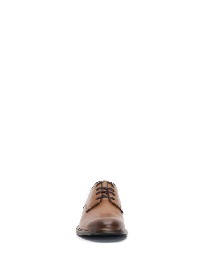 A single Vince Camuto Men’s Lyre Derby in brown leather with dark laces, showcasing its timeless style, is viewed from the front against a plain white background.