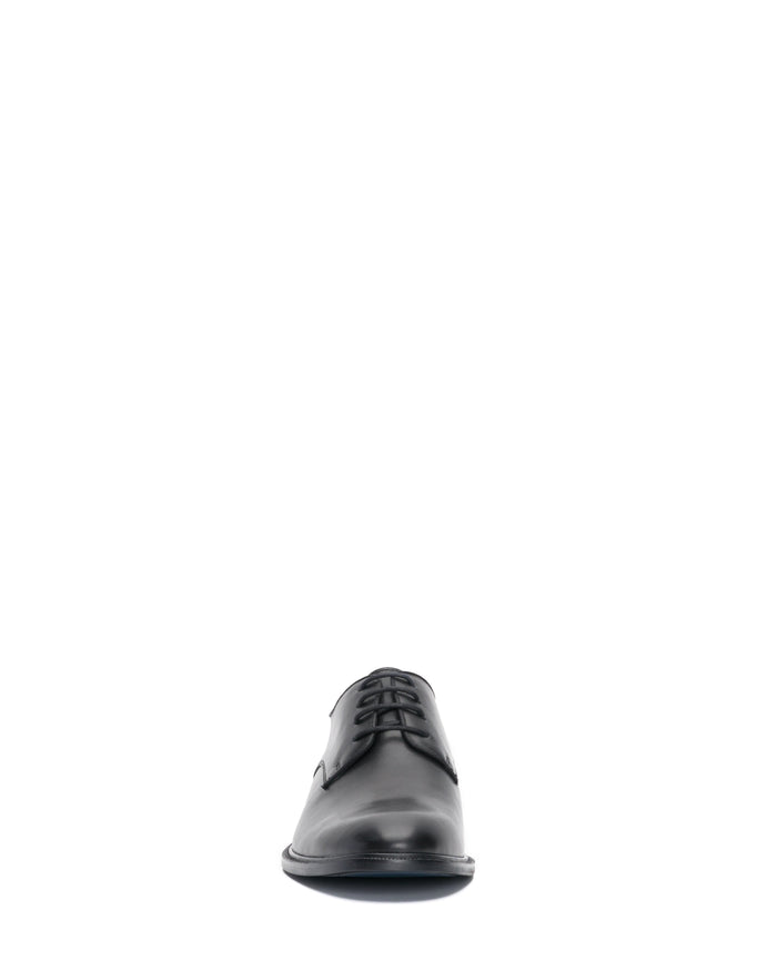 A single Vince Camuto Men’s Lyre Derby dress shoe in classic black leather, shown from the front against a white background.