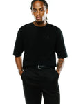 Black Mens Makai Textured Knit T-Shirt, featuring a relaxed fit, short sleeves, and a subtle tonal embroidered Psycho Bunny skull logo on the left chest.