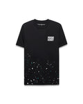 Mens Malcolm Graphic Tee, black classic fit jersey knit with white Psycho Bunny text on left chest, small embroidered bunny skull, and a vibrant white, teal, dark blue paint splatter graphic on the lower half.