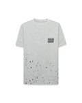 Mens Malcolm Graphic Tee, a grey jersey t-shirt with a classic fit, featuring a pink, black, and red splatter print on the lower half and a black Psycho Bunny text logo on the right chest.