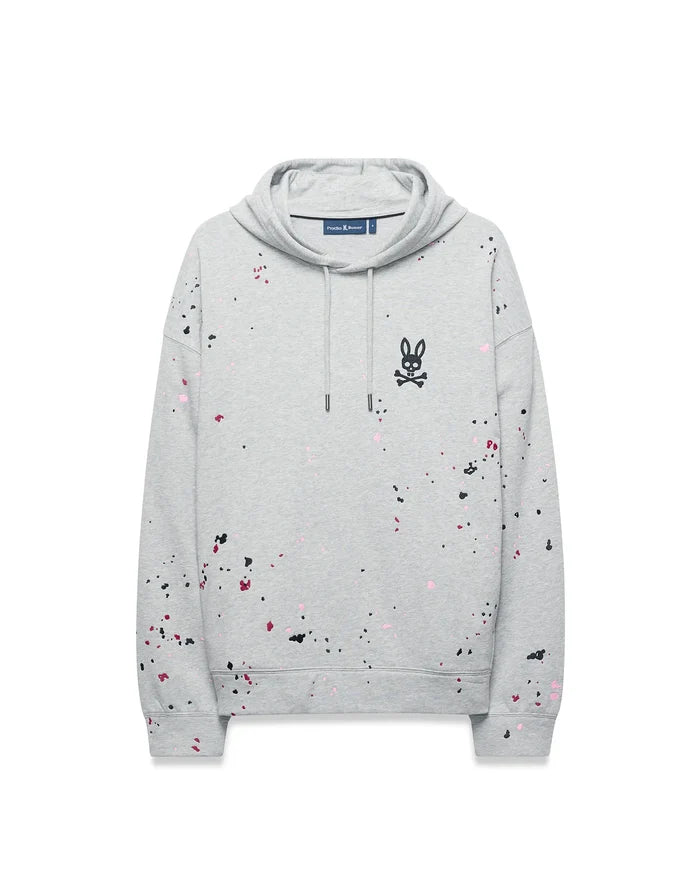 Mens Malcom Splatter Hoodie, a grey relaxed fit French terry hoodie with black, pink, and red splatter paint, featuring an embroidered black Psycho Bunny skull logo on the left chest.