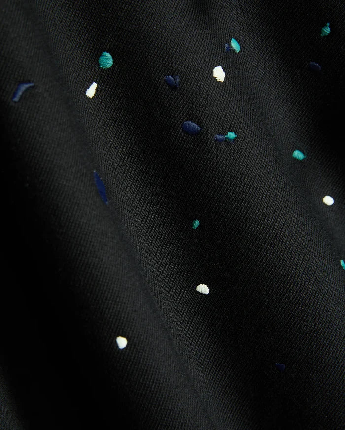 Mens Malcom Splatter Hoodie in black, featuring a soft knit fabric with an embroidered multi-color splatter pattern in white, teal, and dark blue.