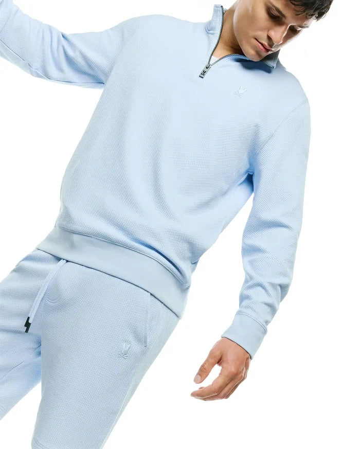 Light blue waffle knit quarter-zip sweatshirt featuring a tonal embroidered Psycho Bunny skull logo on the chest, paired with matching Mens Marc Textured Short with a tonal bunny skull logo on the left thigh.