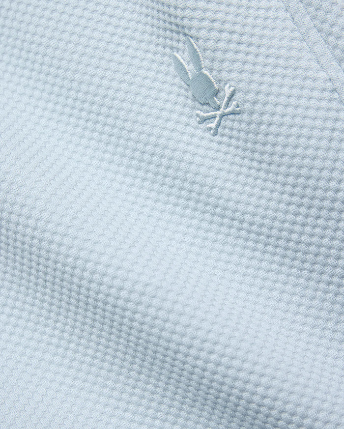Mens Marc Textured Short in light blue, featuring a premium textured knit fabric and a small, iconic tone-on-tone embroidered Psycho Bunny skull logo.