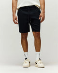Mens Maxton Waffle Sweatshort in black, featuring a relaxed fit, textured waffle knit fabric, and an adjustable drawstring waist with sleek metal tips.