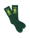 MENS MIKE SPORT SOCK in dark green knit, featuring a ribbed cuff with a large neon yellow Psycho Bunny skull logo over a globe, flanked by PSYCHO and BUNNY text.