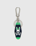 Mens Motel Keychain featuring a dark navy fob with bright green stripes and a prominent white Psycho Bunny skull logo with green ears, attached to a silver carabiner clip and key ring.
