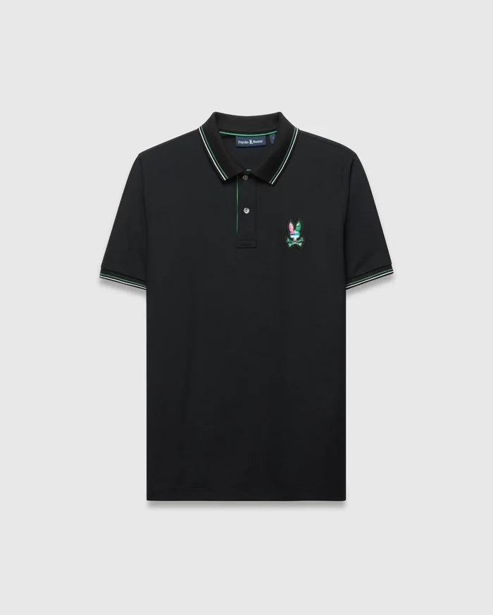 Mens Nate Pique Polo in black, a classic fit pique knit featuring a ribbed collar and cuffs with green and white tipping, and a small, embroidered, multi-colored Psycho Bunny skull logo on the left chest.