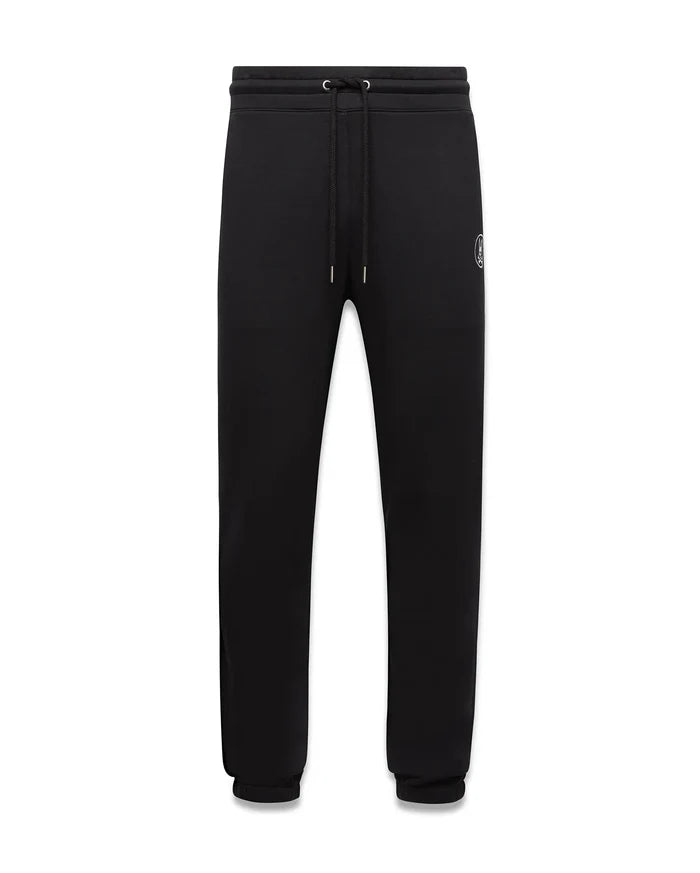 Mens Nathaniel Sweatpant, black relaxed fit french terry sweatpants featuring a drawstring waist, ribbed cuffs, and a small embroidered white Psycho Bunny skull logo on the left thigh.