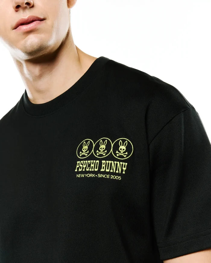 Men's Nathaniel Oversized Pima Tee, black pima cotton jersey with an oversized fit, featuring an embroidered neon yellow left chest logo of three bunny skulls, Psycho Bunny text, and New York • Since 2005.