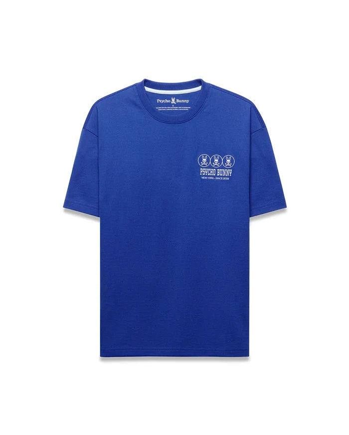 Mens Nathaniel Relaxed Fit Tee, a vibrant royal blue jersey t-shirt with a white center chest graphic featuring three Psycho Bunny skull logos, brand name, and New York Since 2005 text.