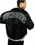 Black Mens Nathaniel Satin Coach Jacket, a relaxed fit, smooth satin jacket with a large white outlined PSYCHO BUNNY text logo across the upper back and a ribbed hem with white double stripes.