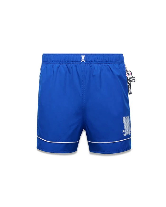 Mens Nathaniel Swim Trunk, royal blue, with white piping, small embroidered Psycho Bunny skull logo on left hip, large white striped graphic logo on right leg, and a black and pink Psycho Bunny tag.