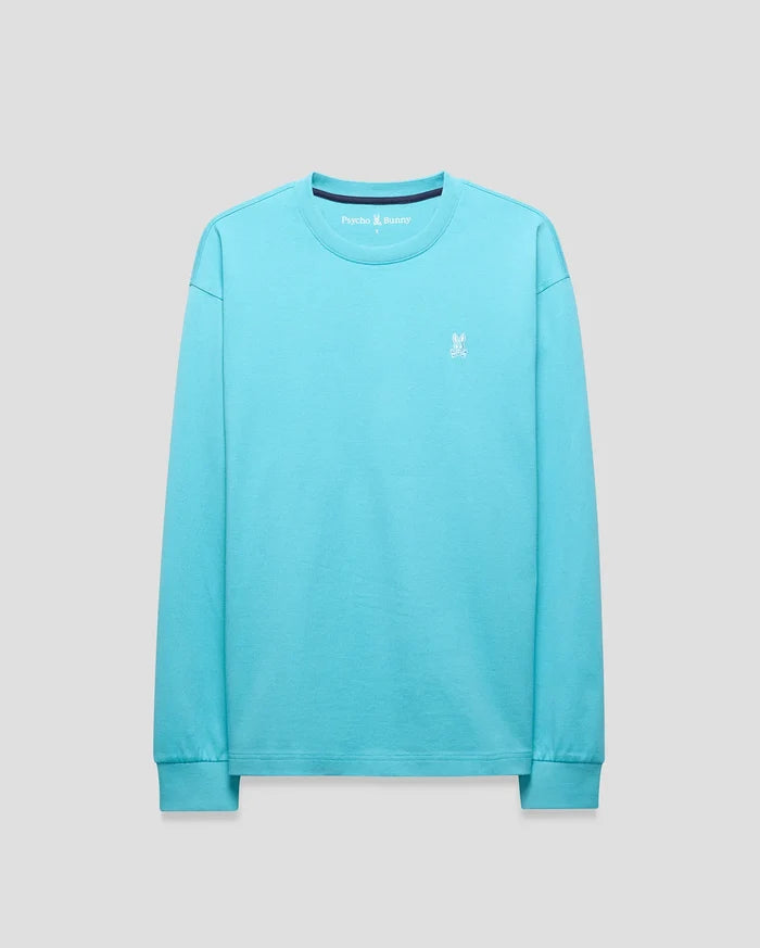 Mens Norman Long Sleeve Relaxed Fit Tee in vibrant aqua jersey knit, featuring a small white embroidered Psycho Bunny skull logo on the left chest, ribbed cuffs, and a navy inner collar.