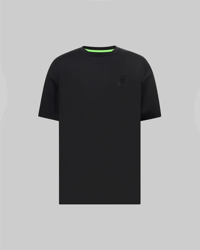 Mens Oscar Oversized Tee in black jersey knit, featuring a relaxed fit, small tonal embroidered Psycho Bunny skull logo on the left chest, and a vibrant neon green inner collar.