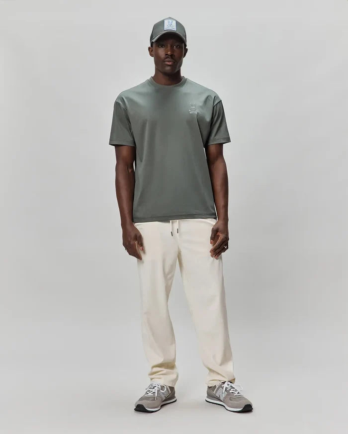 Mens Oscar Oversized Tee in dark sage green, featuring a smooth jersey knit fabric and a small, embroidered light grey Psycho Bunny skull logo on the left chest for a refined streetwear look.