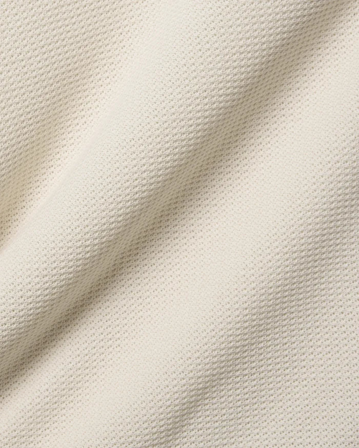 Mens Peter Knit Vest in ecru, a premium textured knit fabric with a soft handfeel and a subtle, repeating micro-waffle pattern, ideal for refined streetwear.