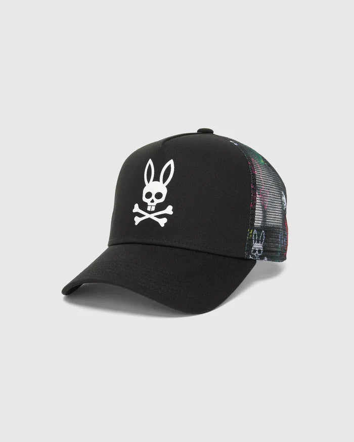 Mens Quintin Trucker Cap featuring a black twill front panel, multicolor patterned mesh back, and a prominent white embroidered Psycho Bunny skull logo.