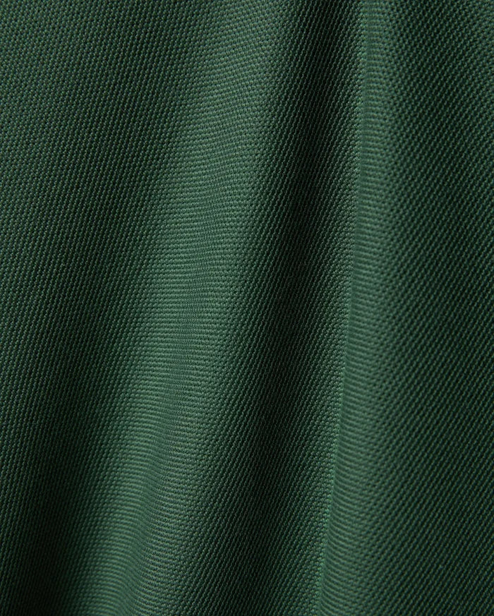 Psycho Bunny Mens Ringston Pique Polo, a premium refined streetwear piece in a rich, deep forest green, highlighting its classic, breathable pique knit texture.