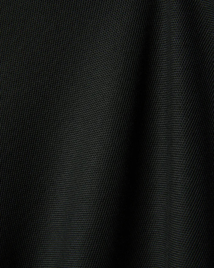 Black Mens Ringston Pique Polo, showcasing its classic pique knit texture, featuring the iconic embroidered Psycho Bunny skull logo on the left chest.