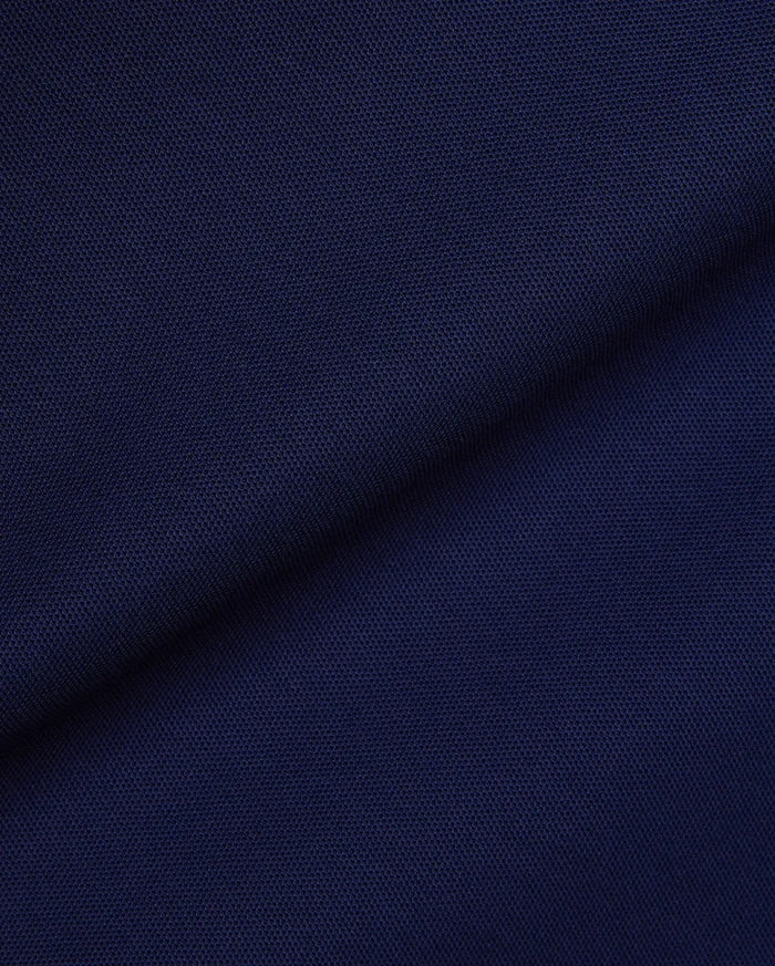 Mens Robin Pique Polo in a rich, deep navy blue, showcasing the classic textured pique fabric, a staple of Psycho Bunny's premium, refined streetwear collection.