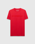 Mens Royce Graphic Tee, a vibrant red classic fit jersey t-shirt with a large, tonal Psycho Bunny text and skull logo graphic on the chest.