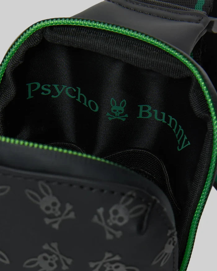 Mens Rubberized Crossbody in black, featuring a repeating debossed Psycho Bunny skull logo pattern on its exterior. Bright green zipper trim and a large green Psycho Bunny text and skull logo on the interior lining add vibrant accents.
