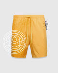 Goldenrod yellow Mens Samos Hydrochromic Printed Swim Trunk with a water-activated tonal bunny skull pattern, elastic drawstring waist featuring Psycho Bunny text, and a small embroidered logo.