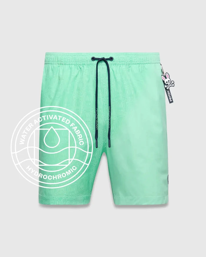 Mens Samos Hydrochromic Printed Swim Trunk 6 in mint green, featuring a subtle hydrochromic bunny skull pattern, dark blue drawstring with Psycho Bunny tips, and an elastic waistband.