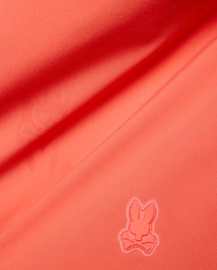 Vibrant Coral Mens Samos Hydrochromic Printed Swim Trunk, crafted from smooth premium swimwear fabric, featuring a raised tonal rubberized Psycho Bunny skull logo.