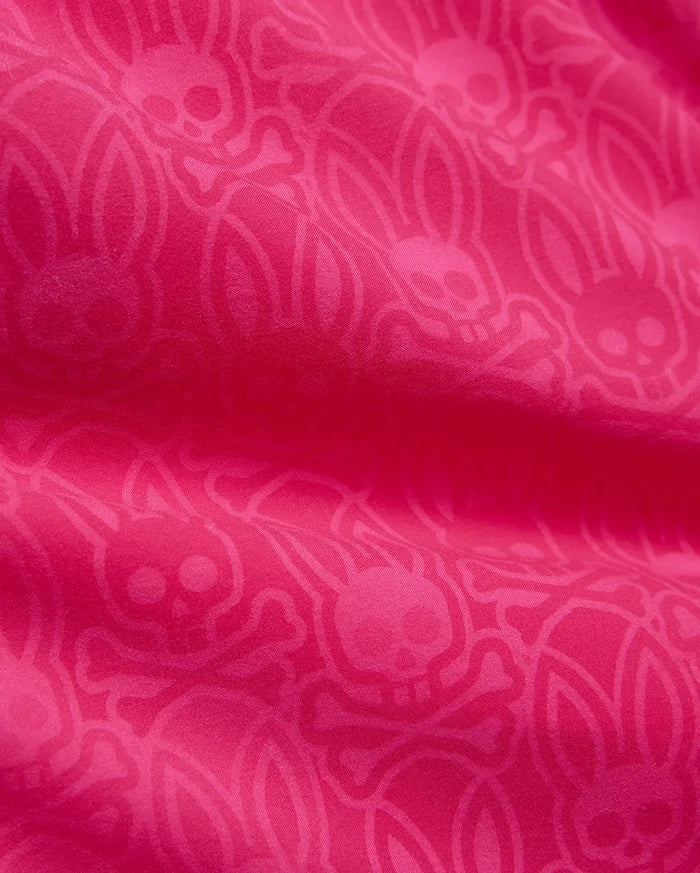 Vibrant fuchsia Mens Samos Hydrochromic Printed Swim Trunk 6, showcasing a subtle, all-over tone-on-tone Psycho Bunny skull and crossbones pattern on smooth fabric.