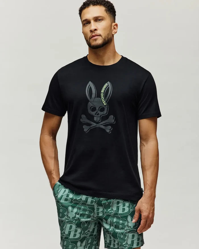 Mens Serge Embroidered Bunny Graphic Tee, black classic fit jersey knit with a large, centered dark grey embroidered Psycho Bunny skull and crossbones logo featuring lime green text.