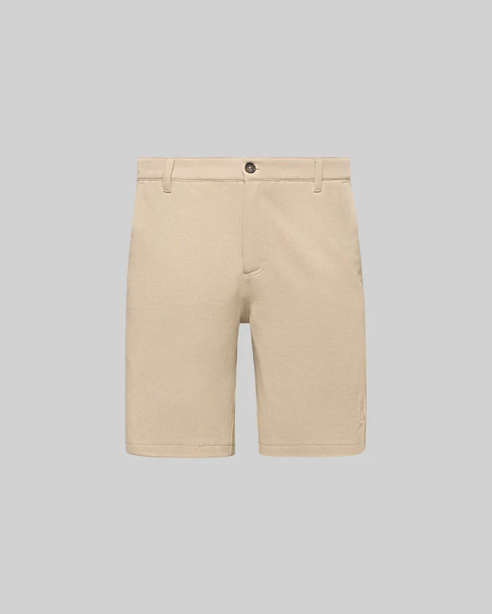 Mens Shiro Twill Short in beige, featuring a classic fit, visible twill texture, button closure, and a small embroidered Psycho Bunny skull logo on the lower left leg.