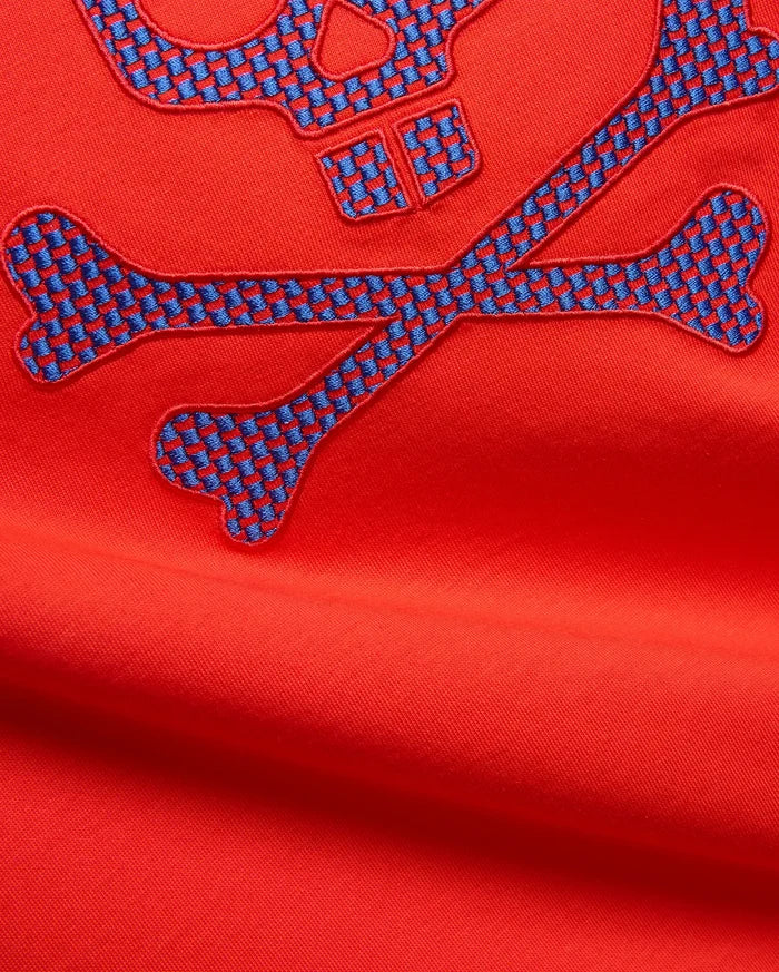 Mens Stan Graphic Tee in vibrant red jersey knit, featuring a large embroidered bunny skull and crossbones logo with a blue and red checkered pattern.