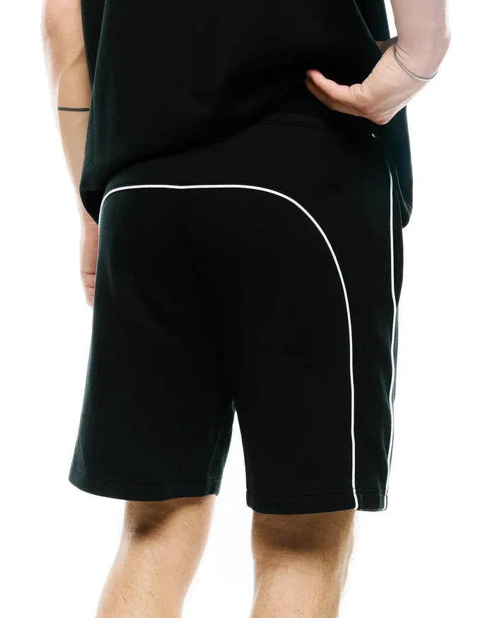 Mens Stevie Short, black relaxed fit jersey shorts featuring prominent white contrast piping that curves across the upper back and extends down the side seams, offering a refined streetwear aesthetic.