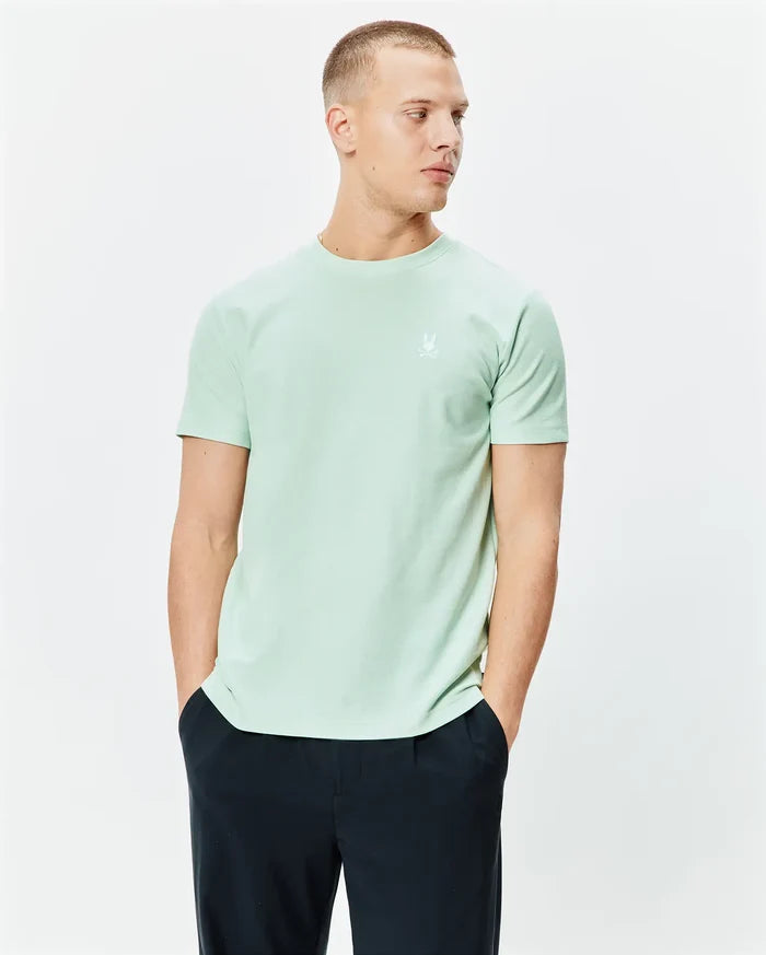 Mens Taylor Pique Tee, a classic fit mint green pique knit t-shirt featuring a small white embroidered Psycho Bunny skull logo on the left chest.